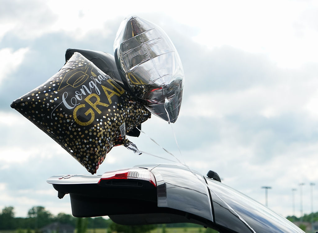 Balloons are displayed on a car